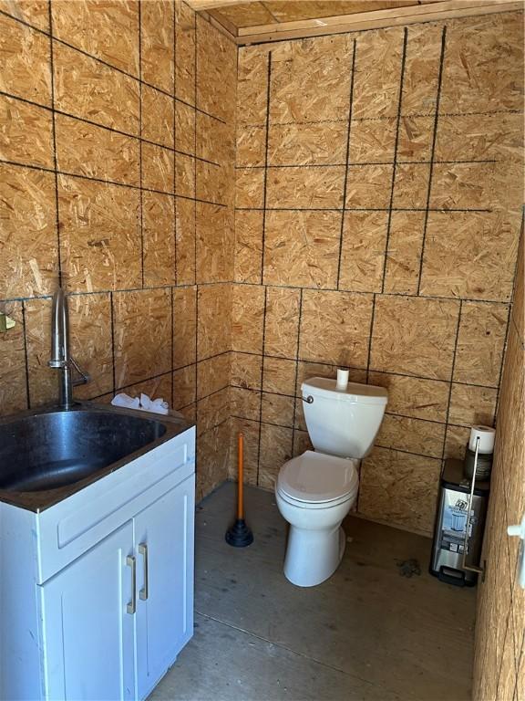345 Ridge Rd, Veteran, NY 14845 - half bath featuring toilet, concrete floors, and vanity
