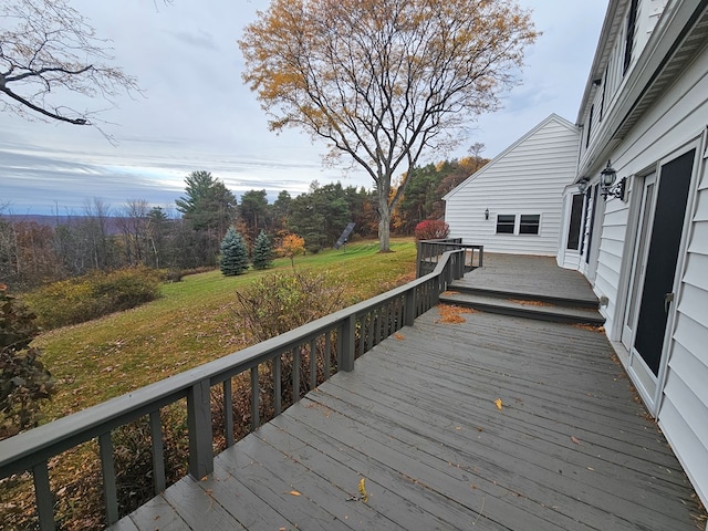 deck featuring a yard