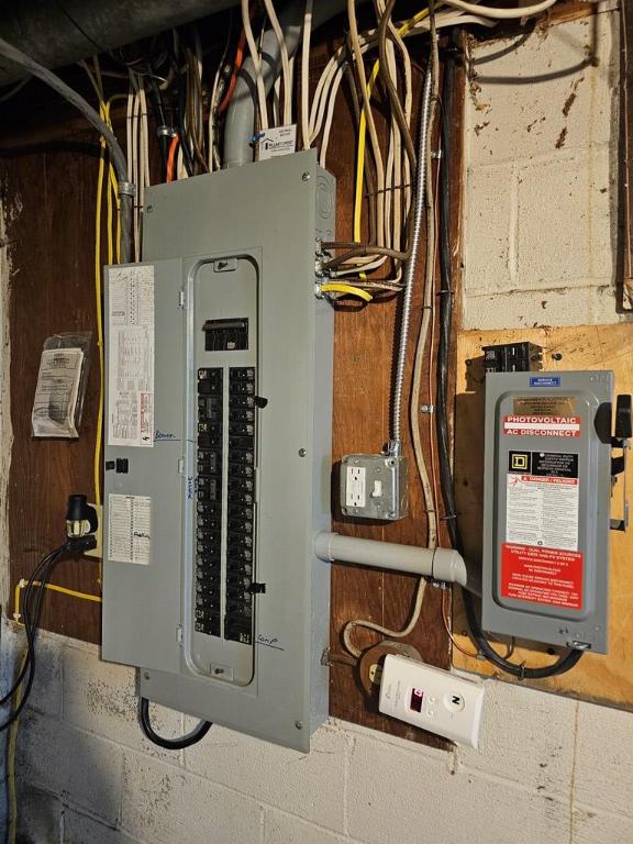 utility room featuring electric panel