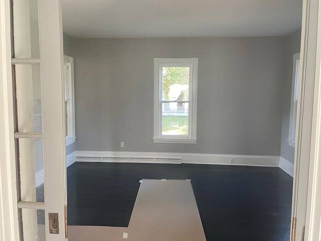 empty room featuring wood-type flooring