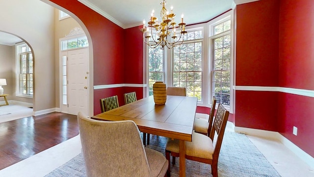 dining space with crown molding and a wealth of natural light