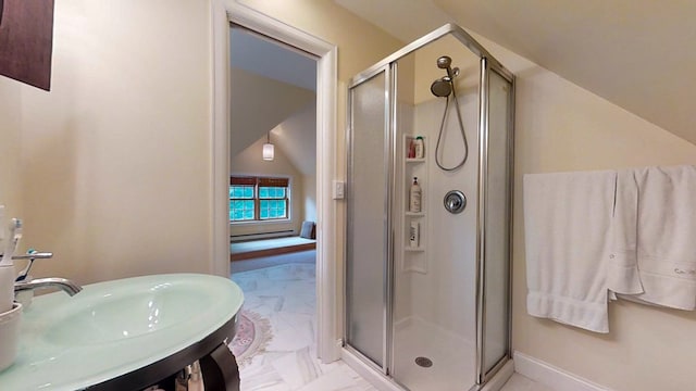 bathroom with lofted ceiling, sink, and an enclosed shower