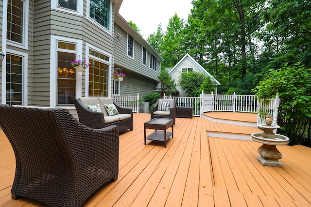 wooden deck with an outdoor hangout area