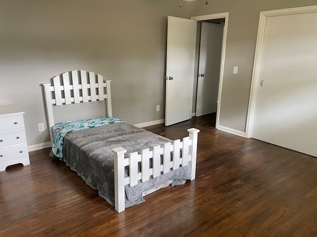 bedroom featuring dark hardwood / wood-style floors