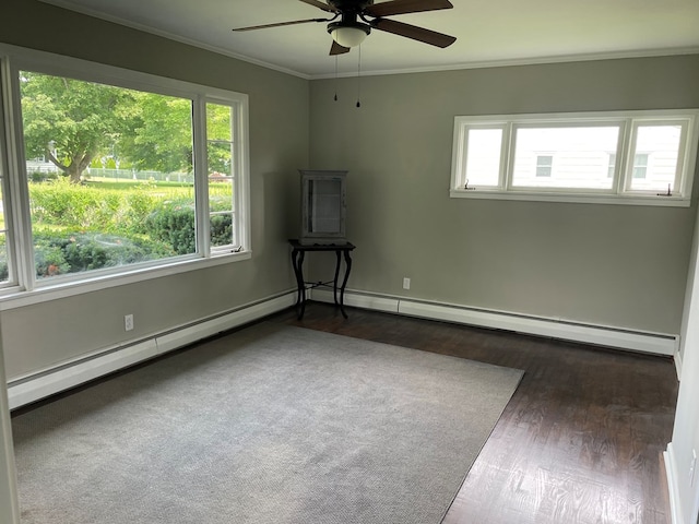 spare room with ornamental molding, dark hardwood / wood-style floors, and ceiling fan