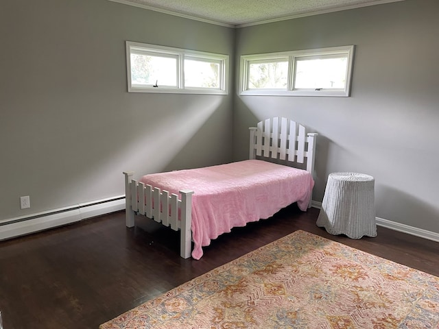 bedroom featuring crown molding, dark hardwood / wood-style floors, a textured ceiling, and a baseboard heating unit