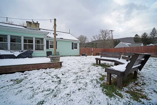 view of yard covered in snow