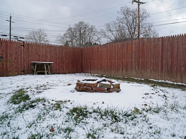 view of yard layered in snow