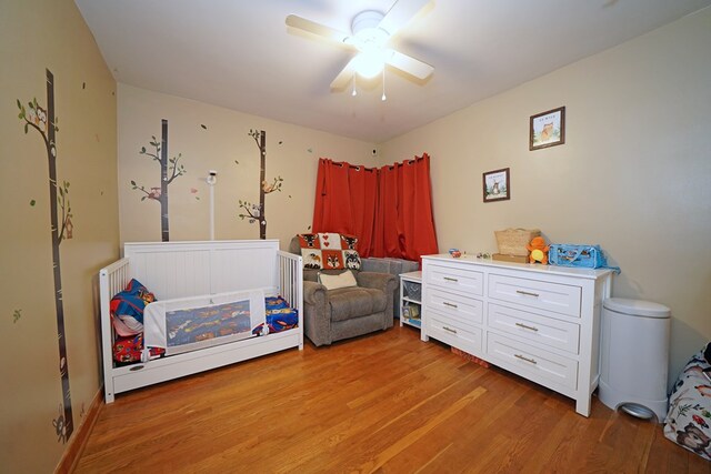 bedroom featuring ceiling fan and light hardwood / wood-style flooring