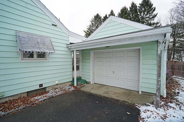 view of snow covered garage