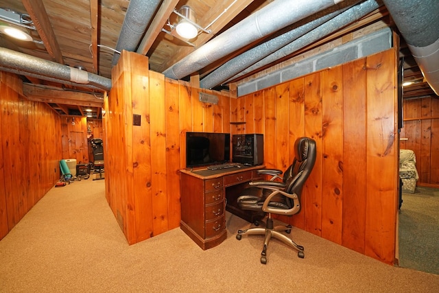 office space featuring wooden walls and carpet flooring