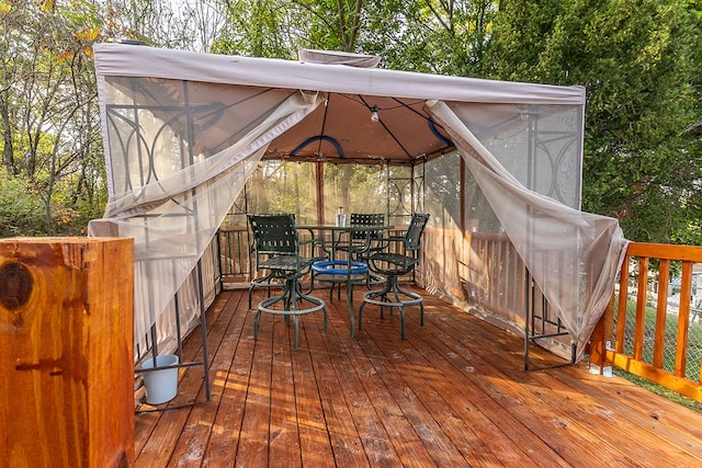 wooden terrace with a gazebo