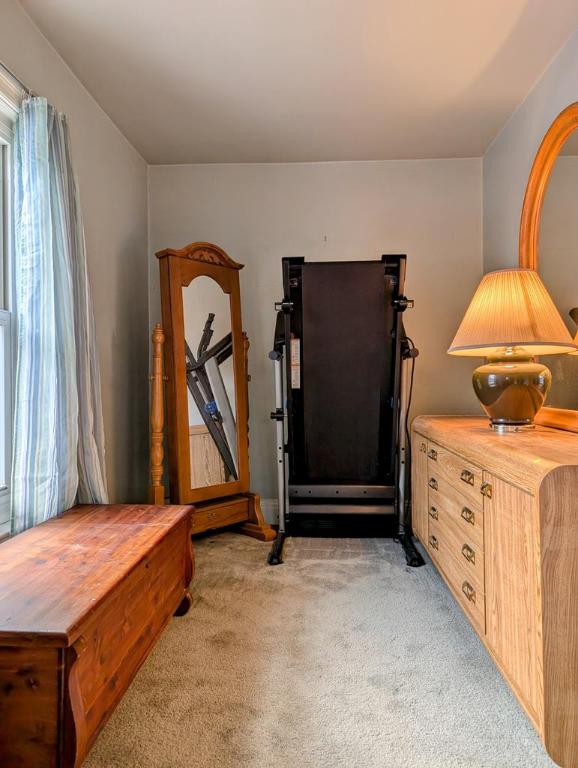 exercise room featuring light colored carpet