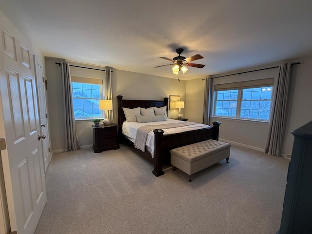 bedroom with ceiling fan and carpet flooring