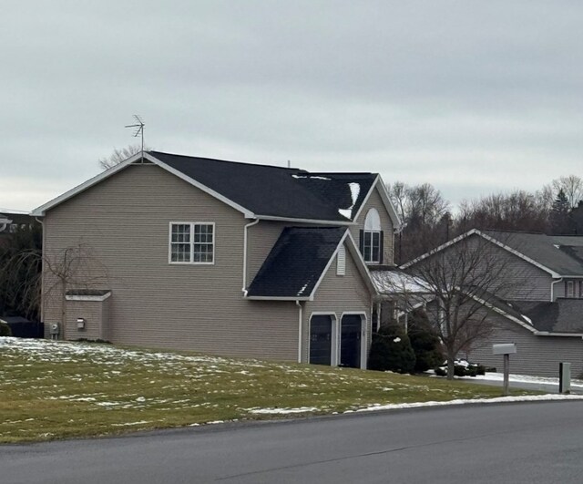 view of side of property with a garage