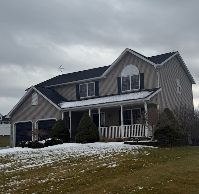 view of front of home with a garage and covered porch