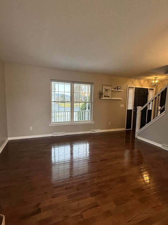 unfurnished room featuring dark hardwood / wood-style flooring