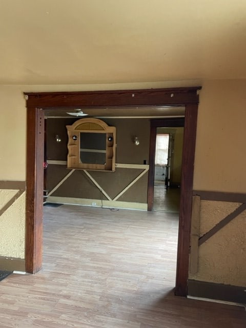 hallway featuring wood-type flooring