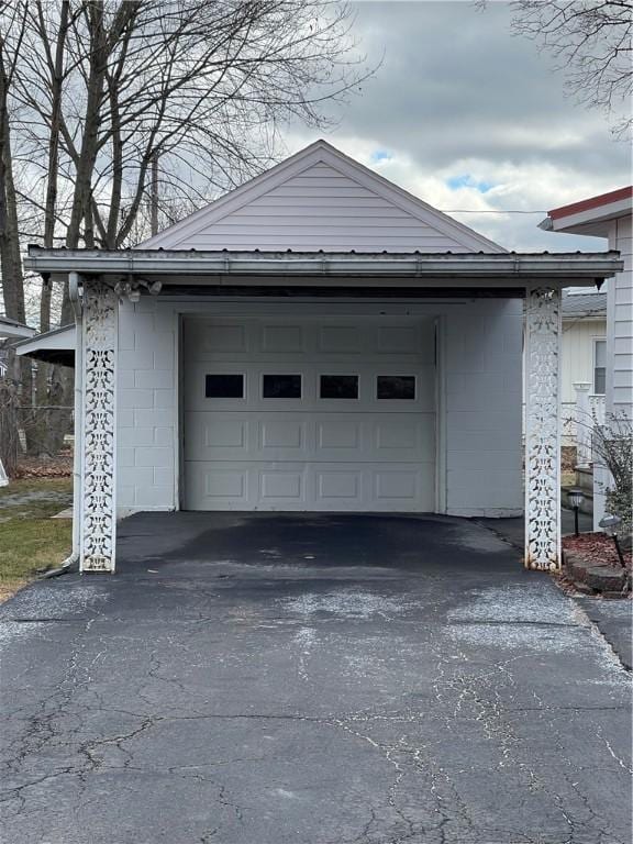 garage featuring aphalt driveway