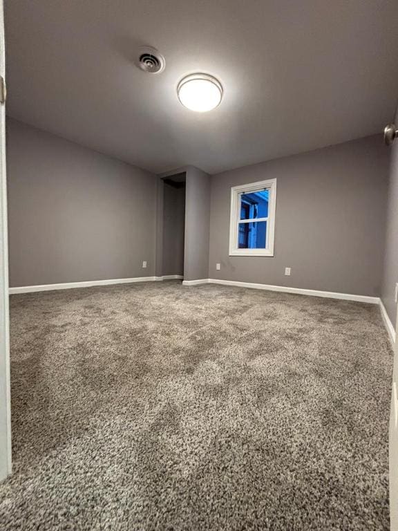 empty room with carpet flooring