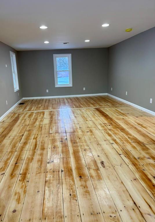 spare room featuring light hardwood / wood-style floors