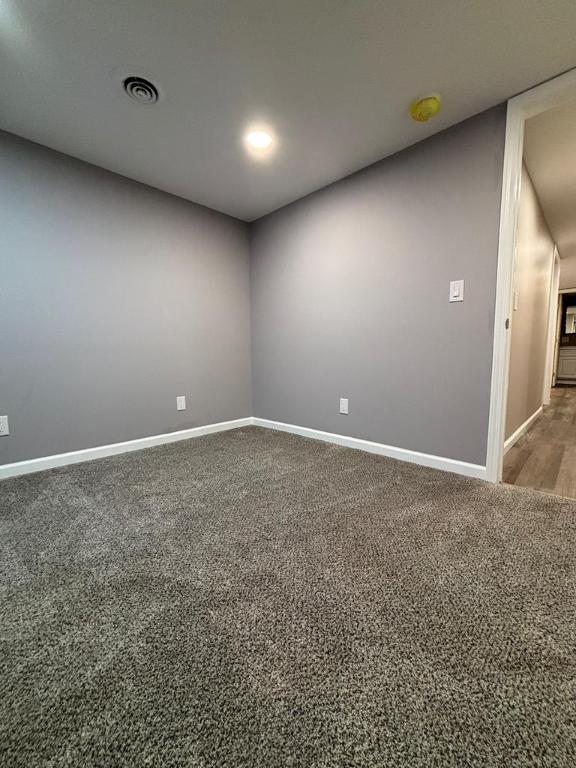 spare room with carpet floors