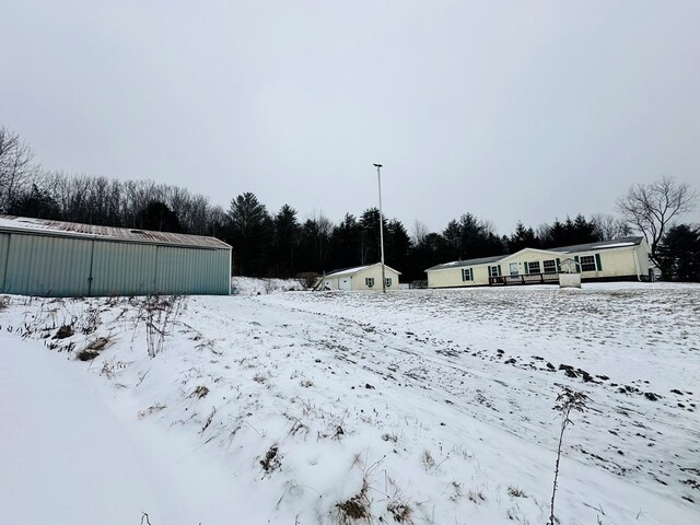 view of yard layered in snow