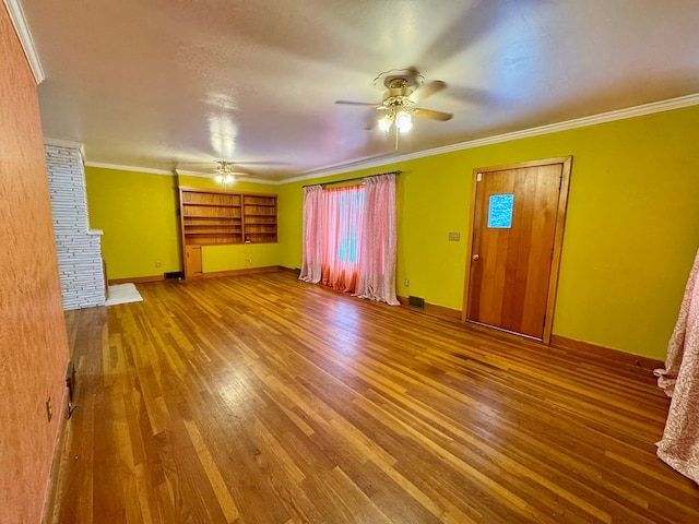 unfurnished living room featuring ornamental molding, hardwood / wood-style floors, and ceiling fan