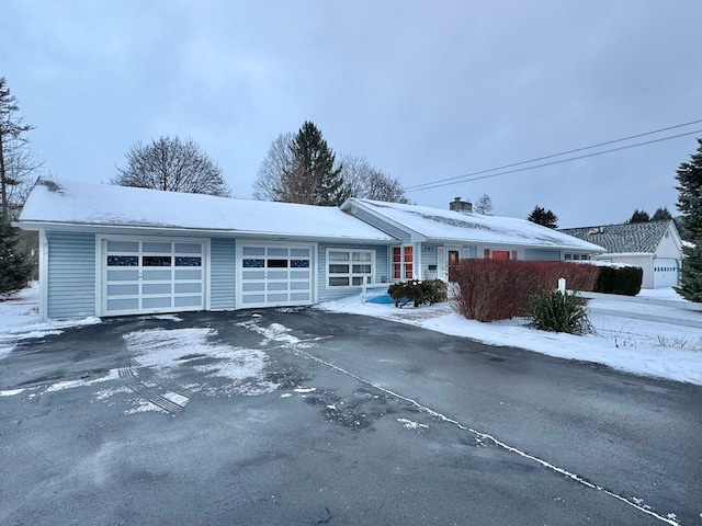 ranch-style home with a garage