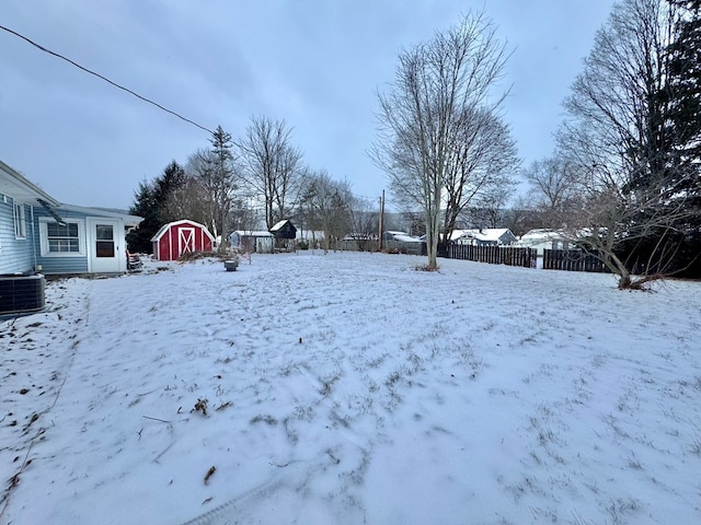 yard layered in snow with central AC