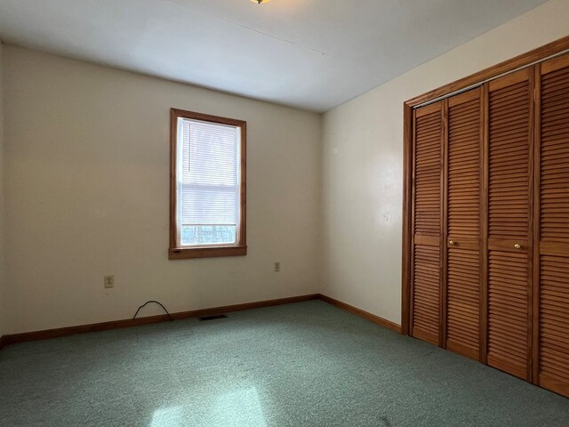 unfurnished bedroom with a closet