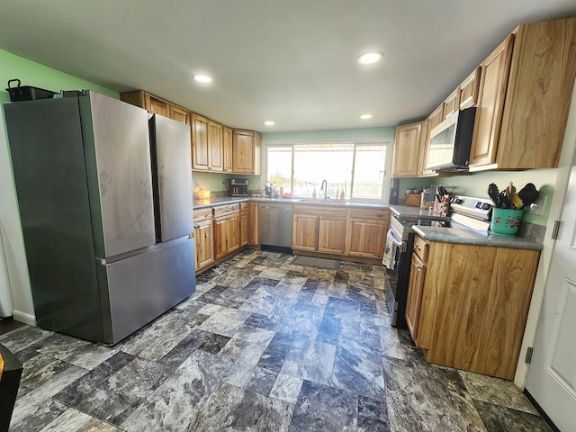 kitchen featuring stainless steel appliances and sink