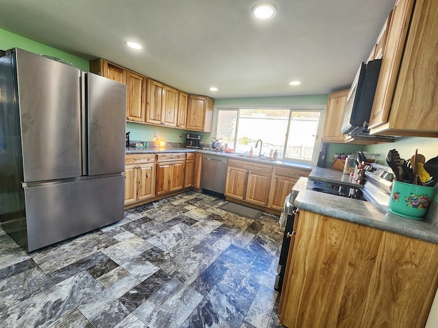 kitchen featuring stainless steel appliances and sink