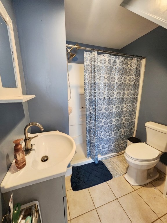 bathroom with a shower with shower curtain, vanity, toilet, and tile patterned flooring