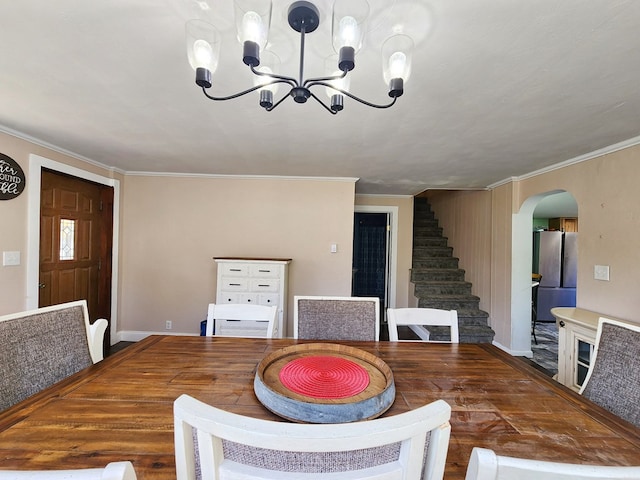 dining room featuring ornamental molding and a chandelier