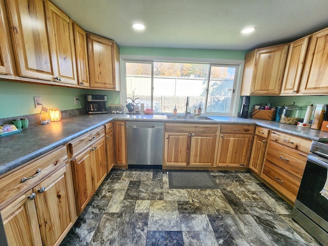 kitchen with appliances with stainless steel finishes and sink