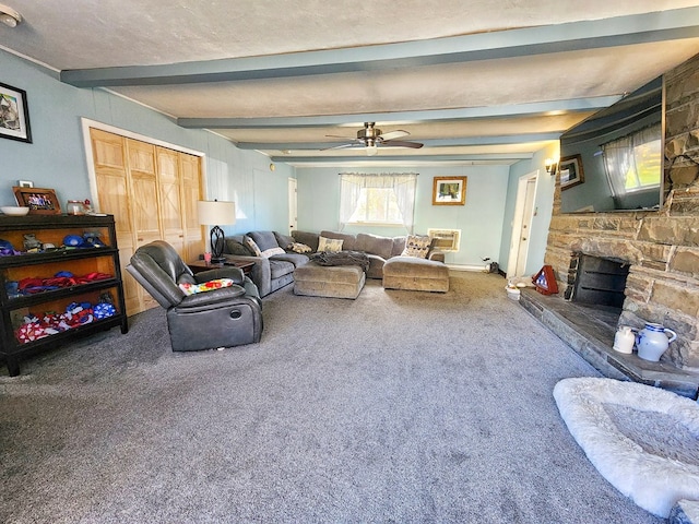 living room with beamed ceiling, a fireplace, carpet flooring, and ceiling fan