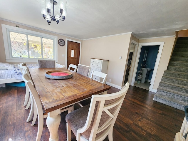 dining area with an inviting chandelier, ornamental molding, and dark hardwood / wood-style floors