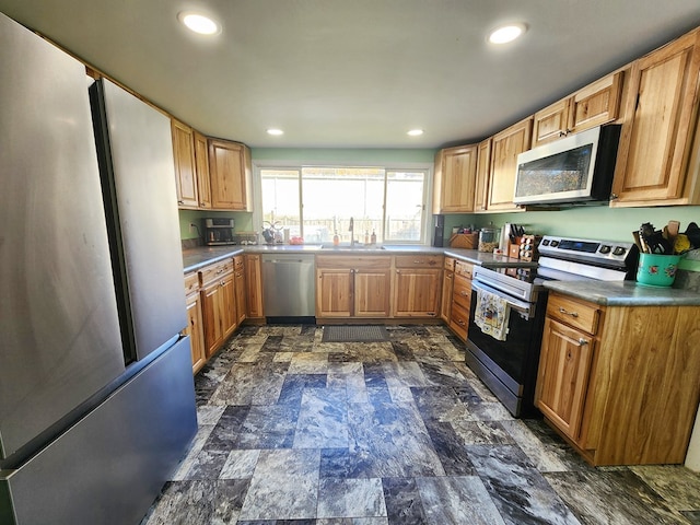 kitchen featuring appliances with stainless steel finishes and sink