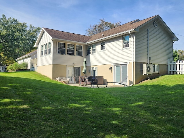 back of property featuring a patio area, a lawn, and ac unit