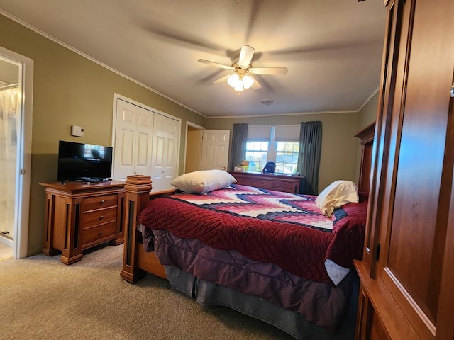 bedroom featuring ornamental molding, light colored carpet, a closet, and ceiling fan