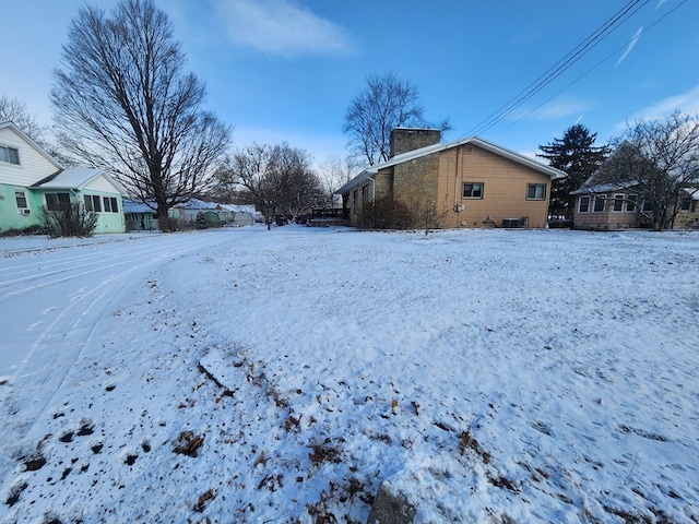 view of yard layered in snow