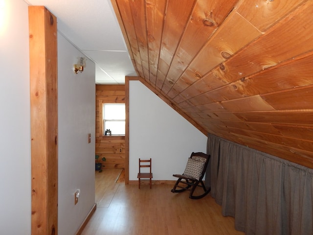 bonus room featuring baseboards, wood ceiling, lofted ceiling, and wood finished floors