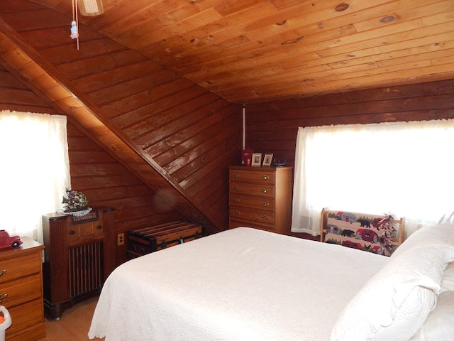 bedroom featuring wooden ceiling, light wood finished floors, wood walls, and lofted ceiling