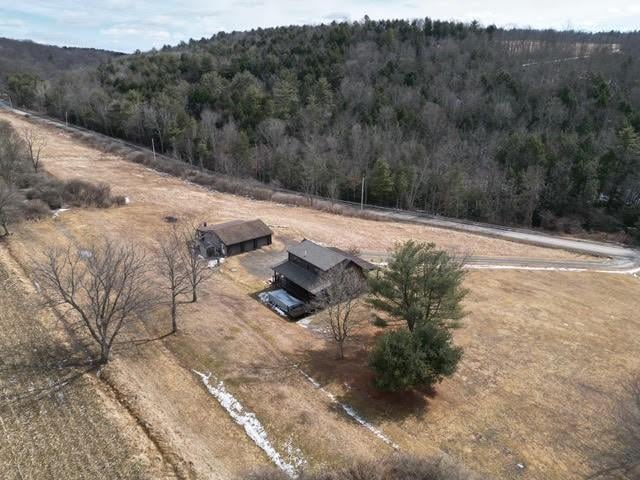 bird's eye view with a forest view and a rural view