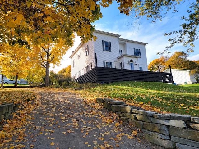 exterior space with fence and a lawn