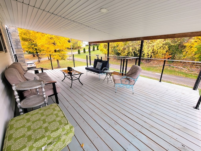 wooden deck featuring an outdoor living space