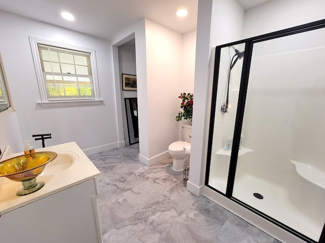 full bath featuring marble finish floor, toilet, a stall shower, vanity, and baseboards