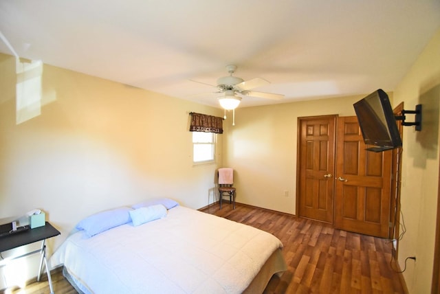 bedroom featuring dark hardwood / wood-style flooring and ceiling fan