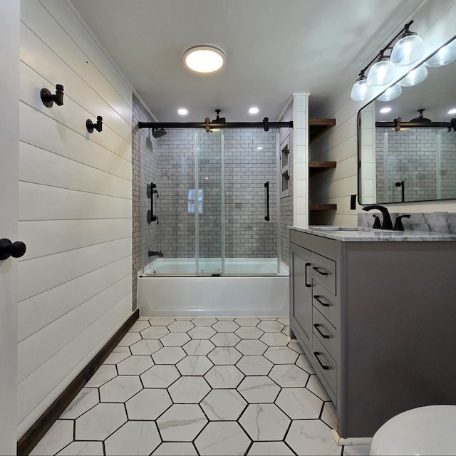 bathroom featuring vanity and enclosed tub / shower combo